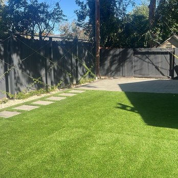 Next Level Landscape - Paver patio, turf, jasmine trellis, recessed outdoor smart lighting - Landscaping Near Me