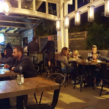 Bushfire Kitchen - Del Mar - Outdoor bar and eating area - American Near Me - Del Mar, California Bushfire Kitchen - Del Mar - Outdoor bar and eating area - American Near Me - Del Mar, California