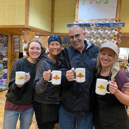 Me with the 3 ladies who work here, all of us holding a Falling Rock cup