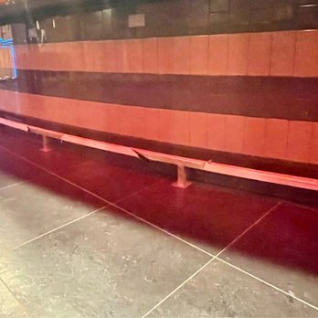 All Better Tile - Commercial bar front.  Bar is curved so tile setting required planning to keep tile level and grout lines even. - Tiling Near Me