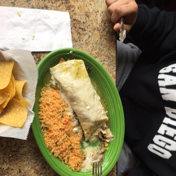 Tres Amigos - Burrito stuffed with chicken, steak, and 3 shrimp. And covered with queso. - Mexican Near Me - Monroe, Ohio Tres Amigos - Burrito stuffed with chicken, steak, and 3 shrimp. And covered with queso. - Mexican Near Me - Monroe, Ohio