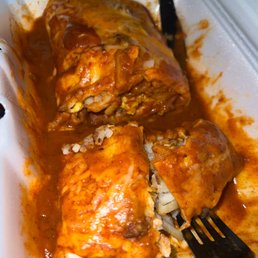 Sausage breakfast burrito smothered in red Sausage breakfast burrito smothered in red