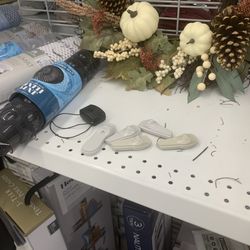 Ross Dress for Less - Shelf with security tags that have been removed. Ross should just put up a sign that read, "if you can get out the door with it, enjoy."