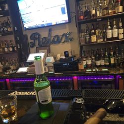 TP Cigar Lounge & Private Bar - The bar area. Smoking a barber poll 708 with a shot of Angel Envy bourbon and a Stella beer. Wonderful