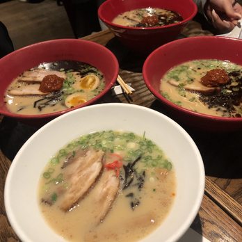 IPPUDO NY - Shiromaru Hakata Classic in the white bowl and three Akamaru Moderns in the red bowls - Ramen Near Me - New York, New York IPPUDO NY - Shiromaru Hakata Classic in the white bowl and three Akamaru Moderns in the red bowls - Ramen Near Me - New York, New York