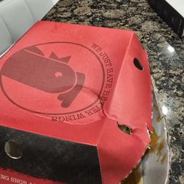Box falling apart and wet and crushed.