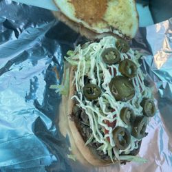 Los Plebes - Torta de asada contain meat, lettuce, tomato, mayonnaise, and jalapeños