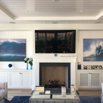 Sound Farmer - TV mounted over fire place with equipment in the cabinet. - Home Automation Near Me Sound Farmer - TV mounted over fire place with equipment in the cabinet. - Home Automation Near Me