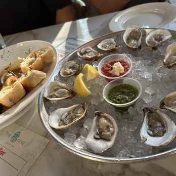 The Dive Oyster Bar - Dozen happy hour oysters and happy hour mussels & clams dish. - Southern Near Me - Irvine, California The Dive Oyster Bar - Dozen happy hour oysters and happy hour mussels & clams dish. - Southern Near Me - Irvine, California