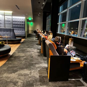 Alaska Lounge - North Satellite - Real recliners, just one of several seating options in the lounge. Behind you can see the curving banquettes for group seating. - Airport Lounges Near Me - Seattle, Washington Alaska Lounge - North Satellite - Real recliners, just one of several seating options in the lounge. Behind you can see the curving banquettes for group seating. - Airport Lounges Near Me - Seattle, Washington