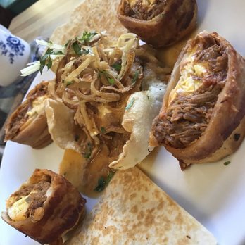 The Corner - Spicy duck scrambled eggs wrapped in a tortilla and bacon with pulled pork,egg, cheese and crispy onion, very flavorful - Breakfast & Brunch Near Me - Milford, Connecticut The Corner - Spicy duck scrambled eggs wrapped in a tortilla and bacon with pulled pork,egg, cheese and crispy onion, very flavorful - Breakfast & Brunch Near Me - Milford, Connecticut
