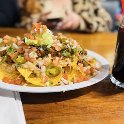 Palapa - Birria Nachos with agua Fresca de Jamaica.