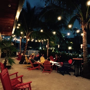 Skipper's Dockside - Outside area complete with white sand, fire pits, play area and ambiance lighting. - Seafood Near Me - Key Largo, Florida