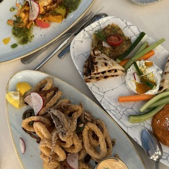 ELIA - Appetizers spread - calamari, Greek dip combo, and grilled squid in the back - Greek Near Me - Walnut Creek, California ELIA - Appetizers spread - calamari, Greek dip combo, and grilled squid in the back - Greek Near Me - Walnut Creek, California