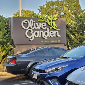 Olive Garden - The outside sign of the restaurant located in the parking lot area. - Italian Near Me - Roanoke, Virginia