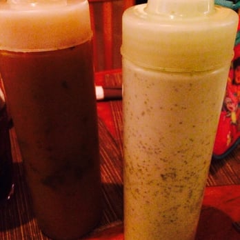 Arepas Cafe - The Infamous green sauce... I almost killed the whole bottle... Que orgullo - Venezuelan Near Me - Astoria, New York