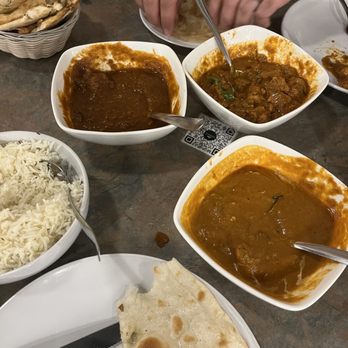 Andaaz Indian Cuisine - a table full of food - Indian Near Me Andaaz Indian Cuisine - a table full of food - Indian Near Me