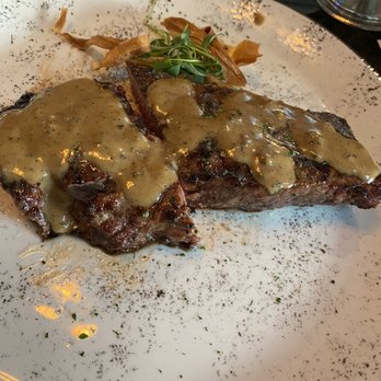 Eddie Merlot's - NY Strip with peppercorn sauce - Seafood Near Me - Boston, Massachusetts