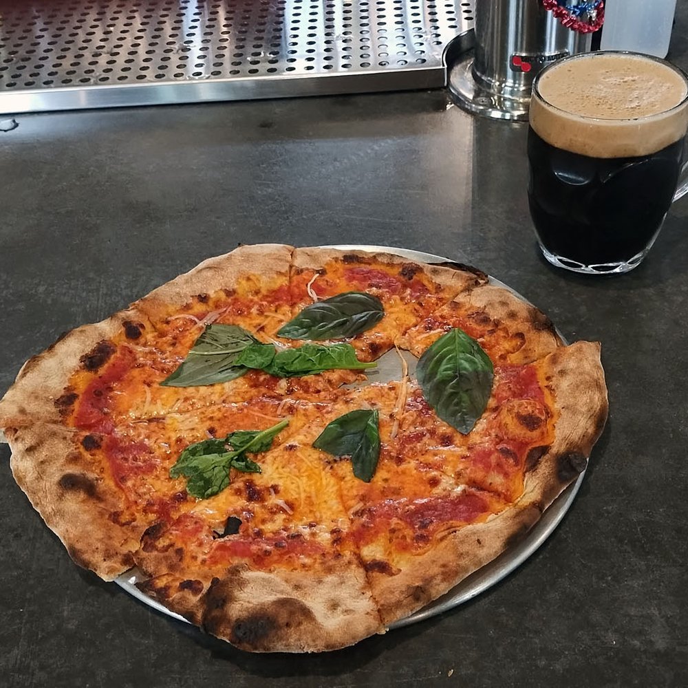 Lost Marble Brewing - Margherita Pizza and an Irish Style Stout
(I jumped the gun and took a bite before photographing!) - Breweries Near Me - Manchester, Vermont Lost Marble Brewing - Margherita Pizza and an Irish Style Stout
(I jumped the gun and took a bite before photographing!) - Breweries Near Me - Manchester, Vermont