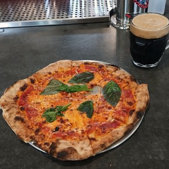 Lost Marble Brewing - Margherita Pizza and an Irish Style Stout
(I jumped the gun and took a bite before photographing!) - Breweries Near Me - Manchester, Vermont Lost Marble Brewing - Margherita Pizza and an Irish Style Stout
(I jumped the gun and took a bite before photographing!) - Breweries Near Me - Manchester, Vermont