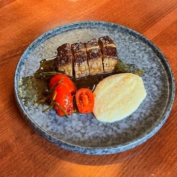 Mi Kitchen - Steak and Grits. 8.8/10. The steak comes Medium rare only per the menu. Ours was cooked perfectly and so juicy. - Tapas Bars Near Me - Franklin, Tennessee