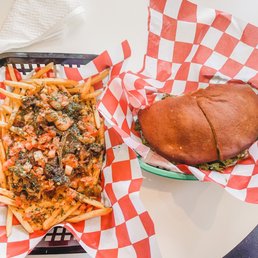 a burger and fries on a table