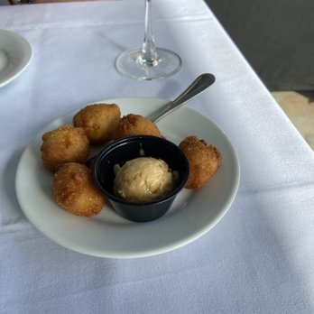 Topsail Restaurant - Complimentary Hushpuppies with honey butter. - Seafood Near Me - Mount Pleasant, South Carolina Topsail Restaurant - Complimentary Hushpuppies with honey butter. - Seafood Near Me - Mount Pleasant, South Carolina