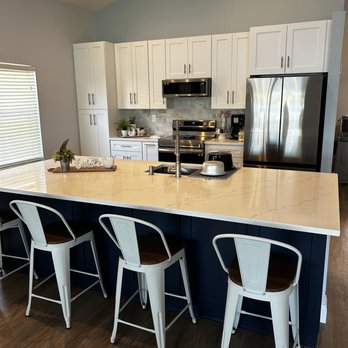 Williams Remodel - a large kitchen with a center island - General Contractors Near Me - Lake Worth, Florida
