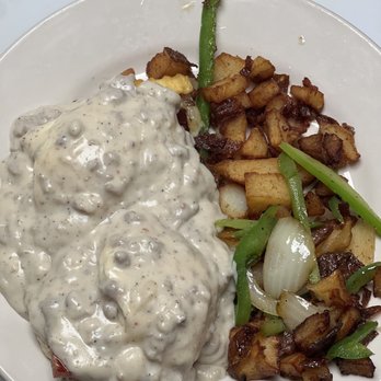 The Hideout Kitchen and Cafe - Biscuits and gravy with home fries - Breakfast & Brunch Near Me - West Palm Beach, Florida The Hideout Kitchen and Cafe - Biscuits and gravy with home fries - Breakfast & Brunch Near Me - West Palm Beach, Florida