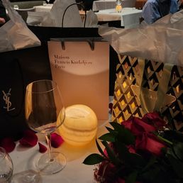 my server suggested and decorated the table with rose pedals my server suggested and decorated the table with rose pedals