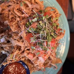 a person holding a plate of food