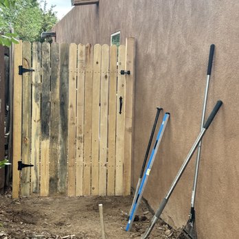Henry’s Tree Experience - We removed a pesky tree stump that was in the way of this fence gate installation. - Landscape Architects or Designers Near Me