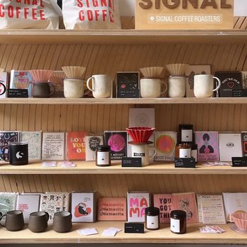 SIGNAL Coffee Roasters - shelves with Signal merch and Mother's Day items - Coffee & Tea Near Me - Alameda, California SIGNAL Coffee Roasters - shelves with Signal merch and Mother's Day items - Coffee & Tea Near Me - Alameda, California