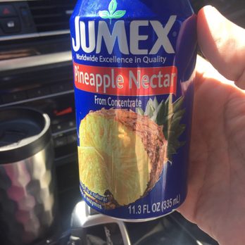 Reposo - a person holding a can of juice - Grocery Near Me - Statesville, North Carolina Reposo - a person holding a can of juice - Grocery Near Me - Statesville, North Carolina
