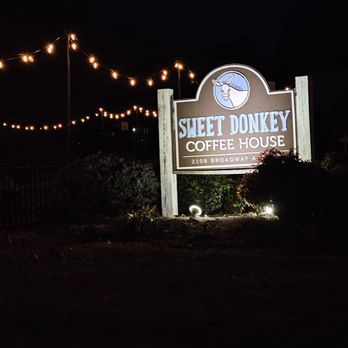 Sweet Donkey Coffee - The outdoor sign of Sweet Donkey Coffee House is lit to be seen in the dark of the night before sunrise. - Coffee & Tea Near Me - Roanoke, Virginia