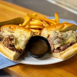 Roccos Town House - Prime Rib Dip Sandwich: thin sliced prime rib of beef with melted swiss & onion au jus