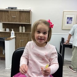 Darien Barber Shop - Girl hair cut by Betty.