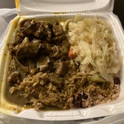 Halfway Tree Jamaican Restaurant - Curry Goat dinner with rice and peas and cabbage.