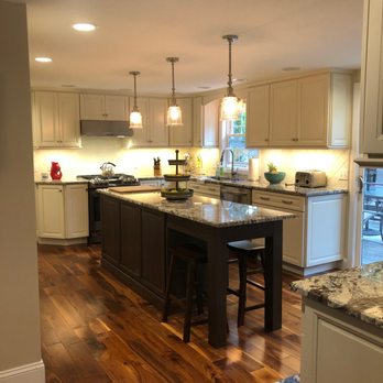DW Remodeling - a kitchen with hardwood floors - General Contractors Near Me - Falmouth, Massachusetts