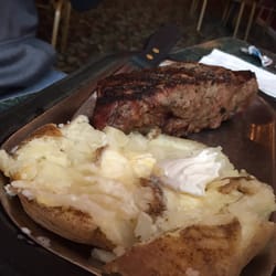 Tommy's Central Street Steak House - 14 oz New York strip with baked potato