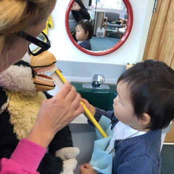 Ruth Becker, DDS, MS - practicing brushing the right way on a stuffed animal. brilliant. :) - Pediatric Dentists Near Me Ruth Becker, DDS, MS - practicing brushing the right way on a stuffed animal. brilliant. :) - Pediatric Dentists Near Me