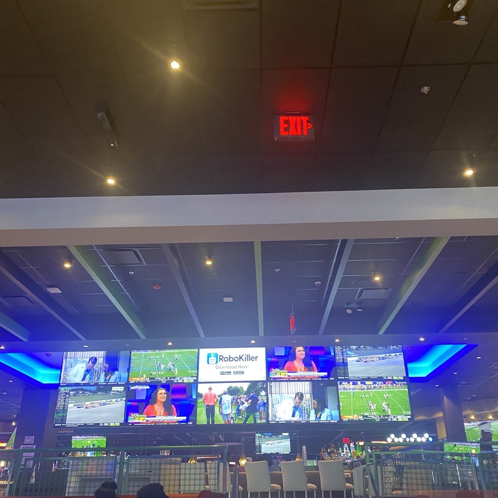 Dave & Buster's - Bar area overlooking the dining section. There are more table seating there as well. - American Near Me - Brooklyn, New York Dave & Buster's - Bar area overlooking the dining section. There are more table seating there as well. - American Near Me - Brooklyn, New York