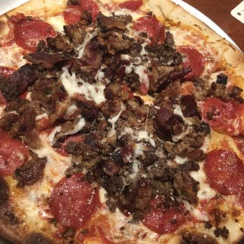 Yard House - The Carnivore Pizza, crispy and filled with meat! Not much sauce though - Bars Near Me - Houston, Texas
