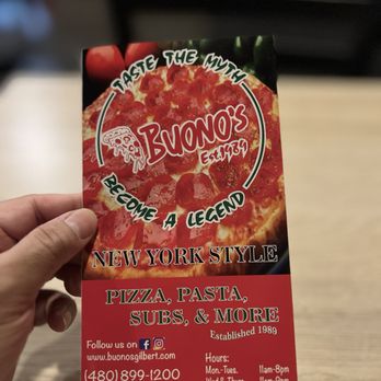 Buono’s Pizza - a hand holding a pizza - Pizza Near Me - Gilbert, Arizona Buono’s Pizza - a hand holding a pizza - Pizza Near Me - Gilbert, Arizona