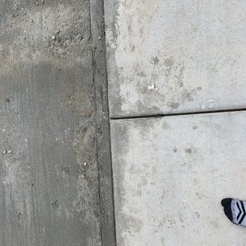 Madrid's Facilities Maintenance - Here you can see the concrete they spilled on my old patio floor - Office Cleaning Near Me Madrid's Facilities Maintenance - Here you can see the concrete they spilled on my old patio floor - Office Cleaning Near Me