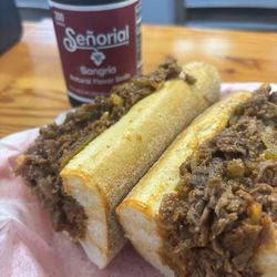 Nice old school steak sandwich with sauce, fried onions and fried hot peppers. Very good.