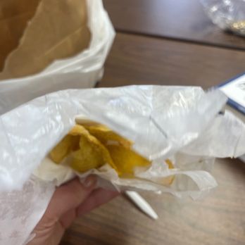 China Wok - a person holding a sandwich in a wrapper - Chinese Near Me - Glendale Heights, Illinois