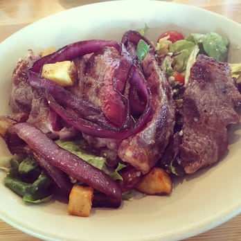 Ava - Grilled steak salad with arugula, cherry tomatoes, gorgonzola, potato croutons, and grilled onions. - Italian Near Me - Tampa, Florida