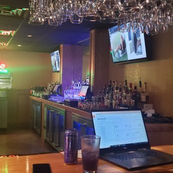 Nicos Pizza - a laptop on a bar counter - Burgers Near Me - West Allis, Wisconsin
