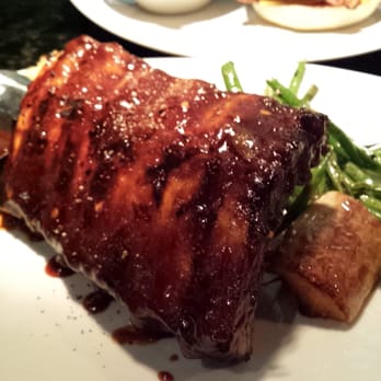 Moxies Fairview Mall Restaurant - Half rack of ribs atop a stuffed baked potato - Canadian (New) Near Me - North York, Ontario Moxies Fairview Mall Restaurant - Half rack of ribs atop a stuffed baked potato - Canadian (New) Near Me - North York, Ontario